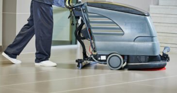 Floor care and cleaning services with washing machine in supermarket shop store